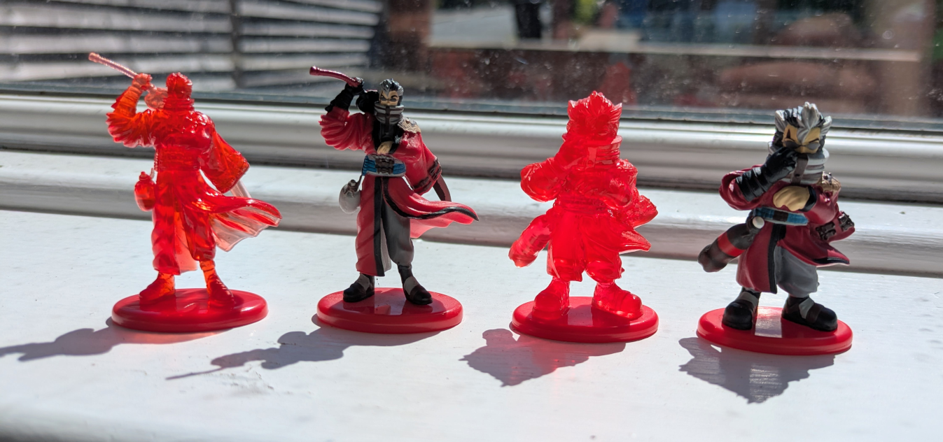 Four very small figures of Auron