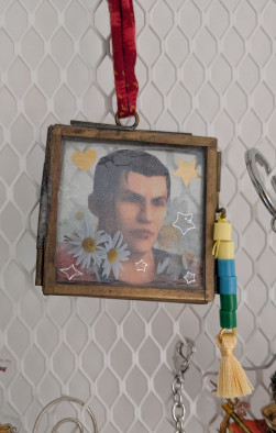 A picture of Auron in a small frame with added decorations