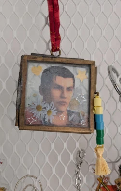 A picture of Auron in a small frame with added decorations
