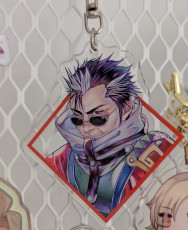 An acrylic charm featuring Auron