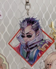 An acrylic charm featuring Auron