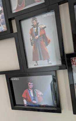 Two framed photos of live-action Auron