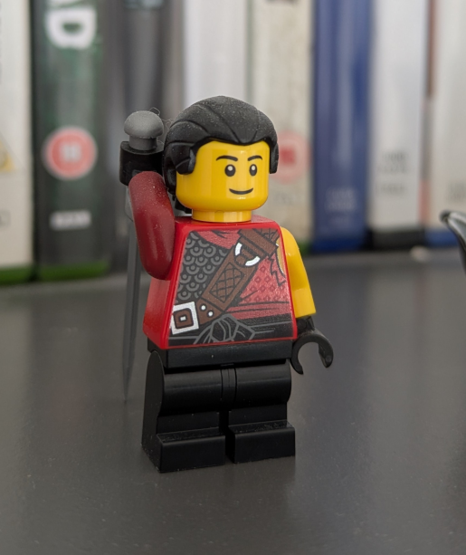 A Lego minifigure resembling Auron’s younger form.
