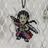 An acrylic charm featuring a pixel young Auron