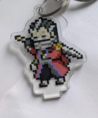 An acrylic charm featuring a pixel Auron